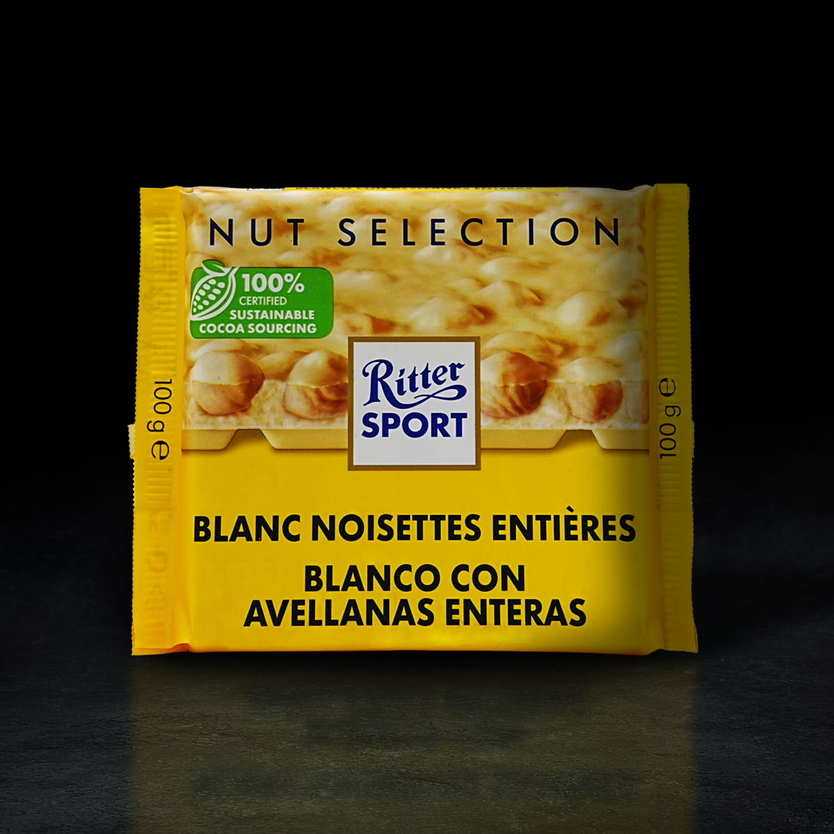 CHOCOLATE BLACO RITTER SPORT CON AVELLANAS ENTERAS 100G